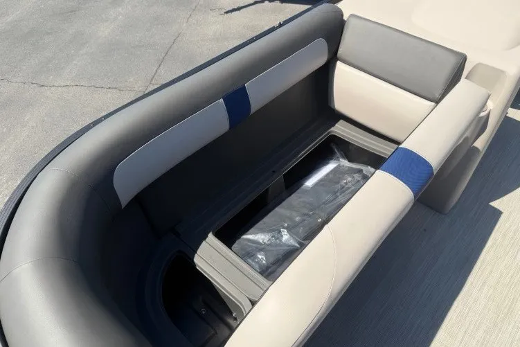 Slide: The Image of 2026 Princecraft Jazz 170 boat seating with storage compartment, featuring gray and blue upholstery. - 10