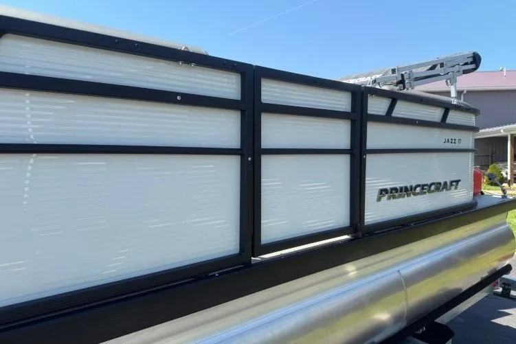 Slide: The Image of 2026 Princecraft Jazz 170 pontoon boat with sleek design and modern features. - 5