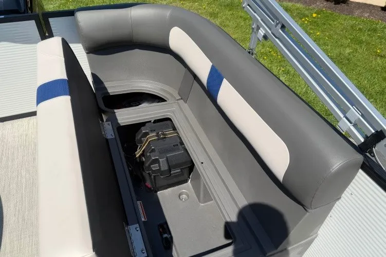Slide: The Image of 2026 Princecraft Jazz 170 boat seating with storage compartment open, revealing battery inside. - 17