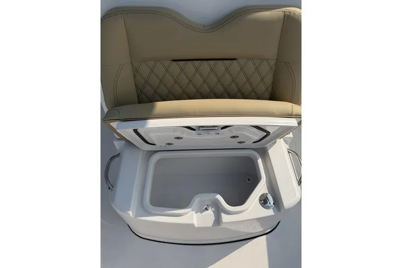 Slide: The Image of 2027 Sportsman Open 262 Center Console seat with storage compartment open. - 25