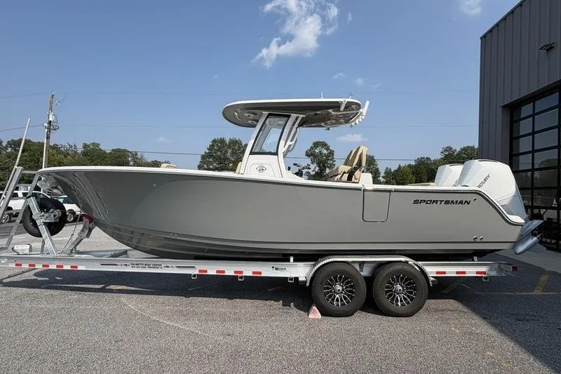 Slide: The Image of 2027 Sportsman Open 262 Center Console boat on trailer, parked outdoors. - 16