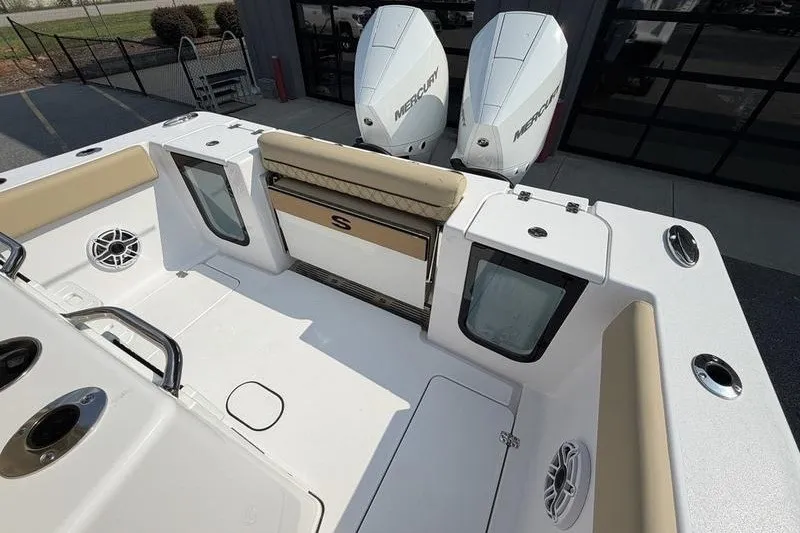 Slide: The Image of 2027 Sportsman Open 262 Center Console boat with dual Mercury engines, spacious deck. - 15