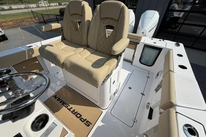 Slide: The Image of 2027 Sportsman Open 262 Center Console with beige seating and modern helm design. - 13