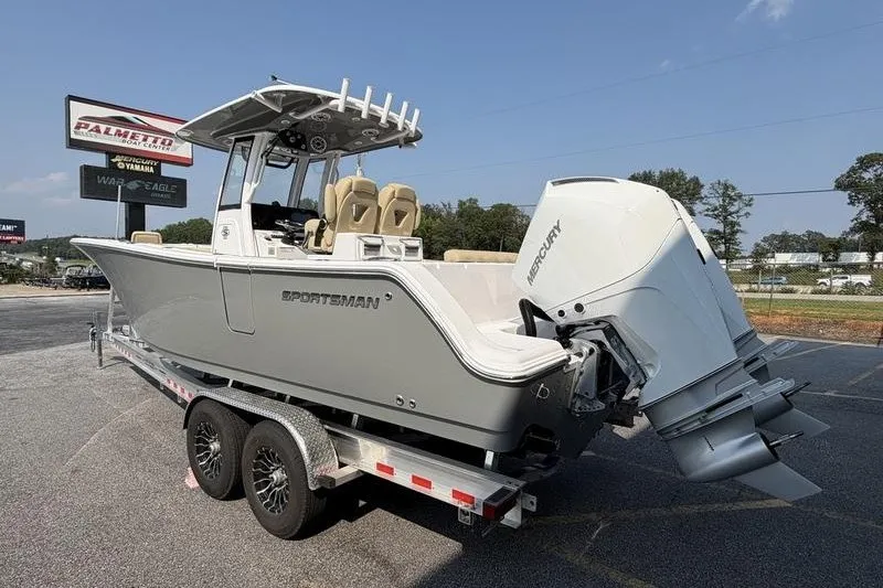 Slide: The Image of 2027 Sportsman Open 262 Center Console boat on trailer, featuring Mercury outboard engine. - 18
