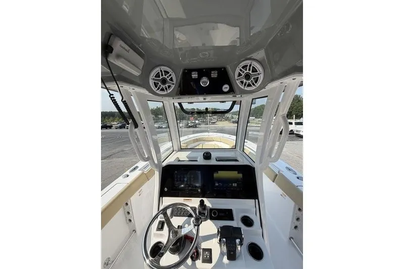Slide: The Image of 2027 Sportsman Open 262 Center Console boat interior with advanced navigation controls. - 27