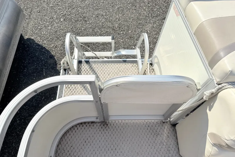 Slide: The Image of 2006 Bennington 2050GL boat interior with seating and entry ladder. - 15