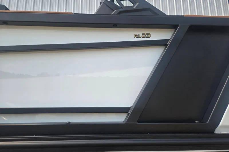 Slide: The Image of Side view of a Revel RL23 boat with modern design and sleek lines. - 4