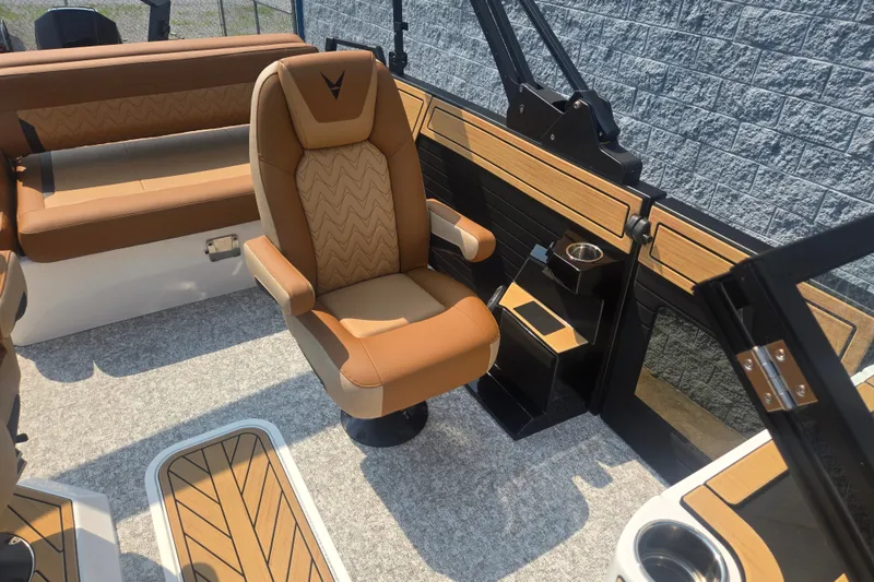 Slide: The Image of The interior of the 2027 Revel RL23 features a swivel captain's chair and stylish upholstery. - 13