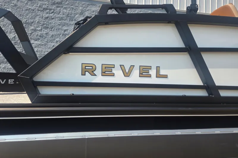 Slide: The Image of The image shows the "Revel" logo on the side of a boat. - 2