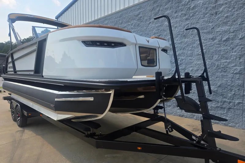Slide: The Image of The image shows a modern boat on a trailer, ready for transport. - 3