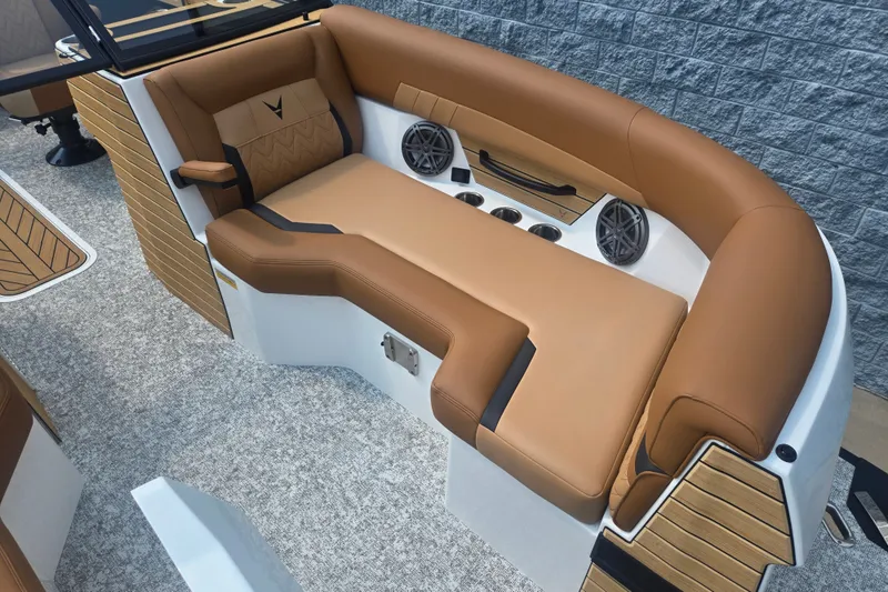 Slide: The Image of The image shows a luxurious boat seat with brown upholstery and built-in speakers. - 15