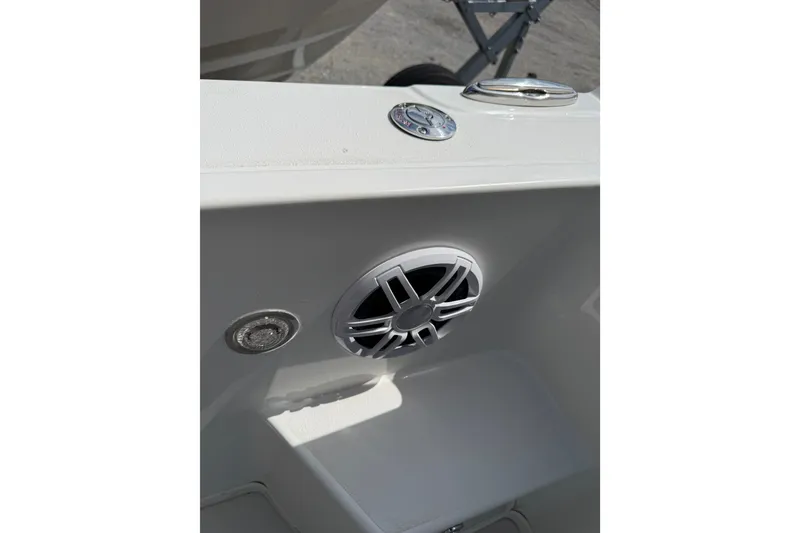 Slide: The Image of 2024 Parker 2320 Sport Cabin boat interior with speaker and metal fixtures. - 9
