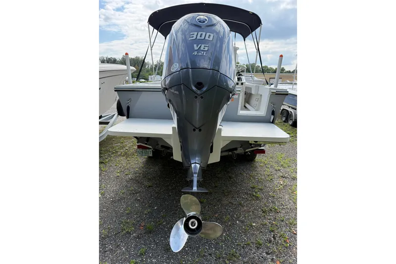 Slide: The Image of 2024 Parker 2320 Sport Cabin boat with powerful 300 V6 engine, rear view. - 4