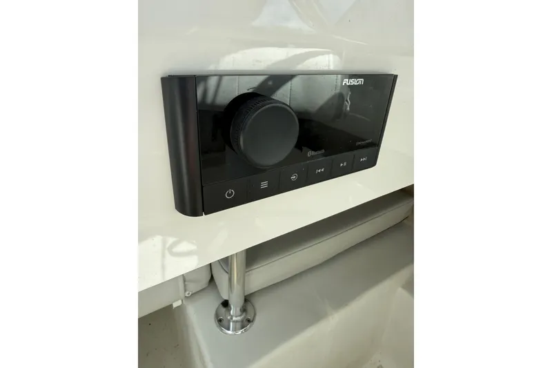Slide: The Image of Fusion audio system in 2024 Parker 2320 Sport Cabin boat interior. - 16