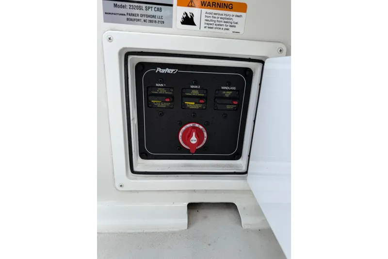 Slide: The Image of Control panel of 2024 Parker 2320 Sport Cabin boat with warning label. - 8