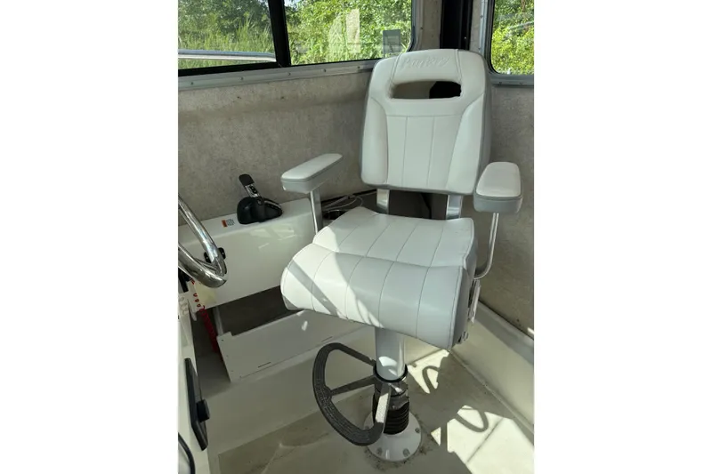 Slide: The Image of Captain's chair in 2024 Parker 2320 Sport Cabin boat interior. - 17