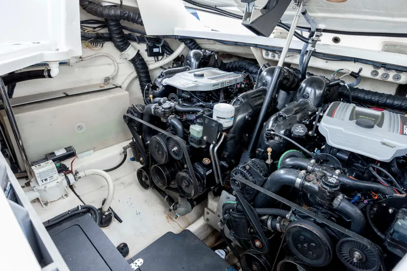 Slide: The Image of Engine compartment of a 2015 Monterey 328SS Super Sport boat, showcasing dual engines. - 33