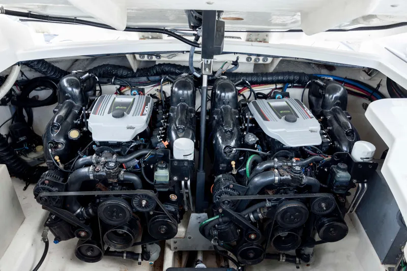 Slide: The Image of Engine compartment of a 2015 Monterey 328SS Super Sport boat, showcasing dual engines. - 31