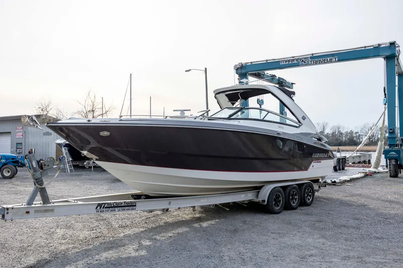Slide: The Image of 2015 Monterey 328SS Super Sport boat on trailer at marina. - 4