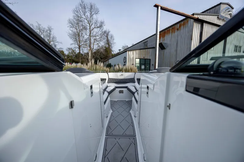 Slide: The Image of 2015 Monterey 328SS Super Sport boat interior with modern seating and sleek design. - 21