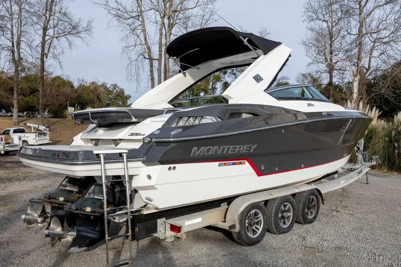 Slide: The Image of 2015 Monterey 328SS Super Sport boat on trailer, parked outdoors. - 1