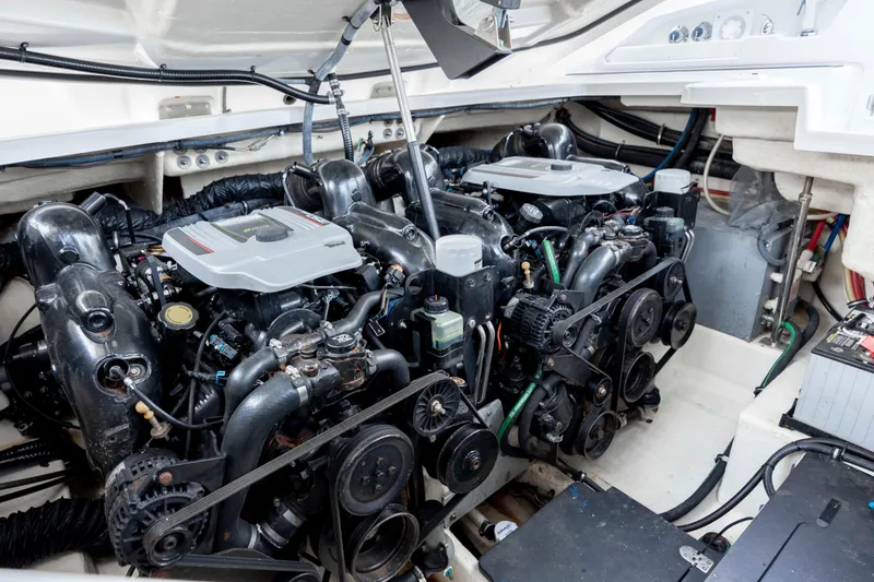 Slide: The Image of Engine compartment of a 2015 Monterey 328SS Super Sport boat, showcasing dual engines. - 32