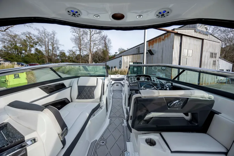 Slide: The Image of 2015 Monterey 328SS Super Sport boat interior with luxurious seating and modern dashboard. - 14