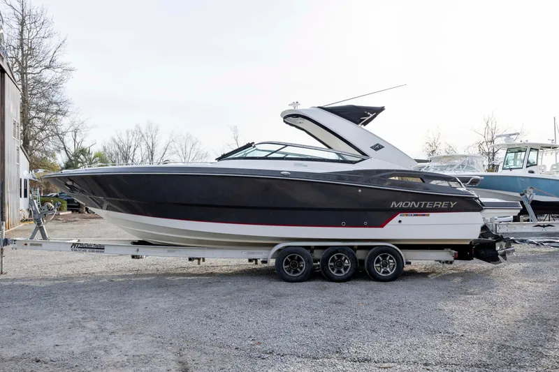Slide: The Image of 2015 Monterey 328SS Super Sport boat on trailer, parked outdoors. - 5