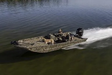 Slide: The Image of Manufacturer Provided Image: 2026 Crestliner 2070 Retriever SCHD boat cruising with passengers and a dog on calm water. - 15