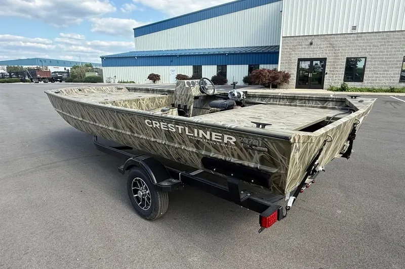 Slide: The Image of 2026 Crestliner 2070 Retriever SCHD boat with camouflage design on a trailer. - 3