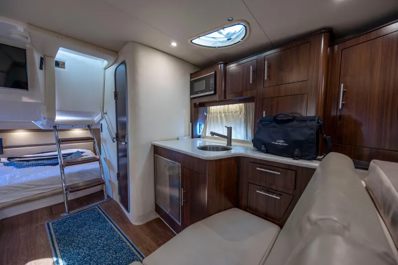 Slide: The Image of Luxurious interior of 2017 Regal 32 Express yacht with kitchenette and sleeping area. - 12