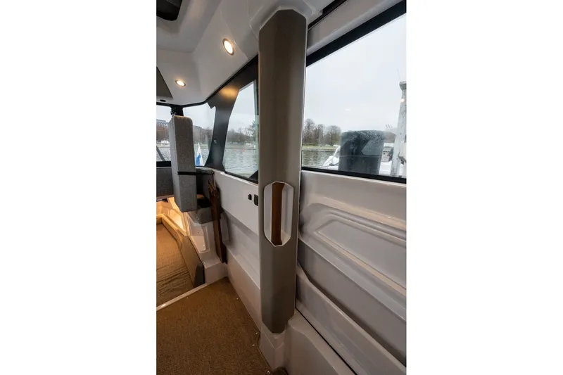 Slide: The Image of Interior view of 2026 Axopar 38 Cross Cabin, featuring modern design and seating. - 41