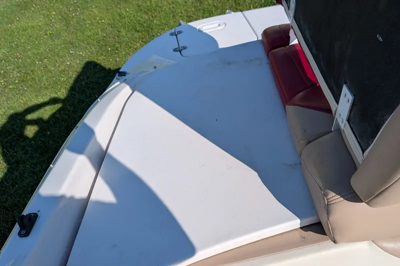 Slide: The Image of 2006 Four Winns 210 Horizon boat interior with seating and sun deck. - 9