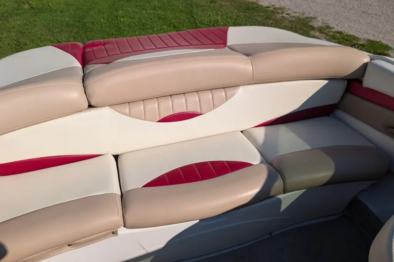 Slide: The Image of 2006 Four Winns 210 Horizon boat interior with beige and red cushioned seating. - 5