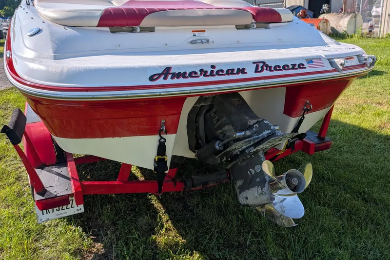 Slide: The Image of 2006 Four Winns 210 Horizon boat named "American Breeze" on a trailer, rear view. - 3