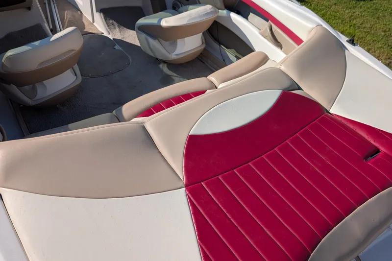 Slide: The Image of Interior of 2006 Four Winns 210 Horizon boat with beige and red seating. - 14