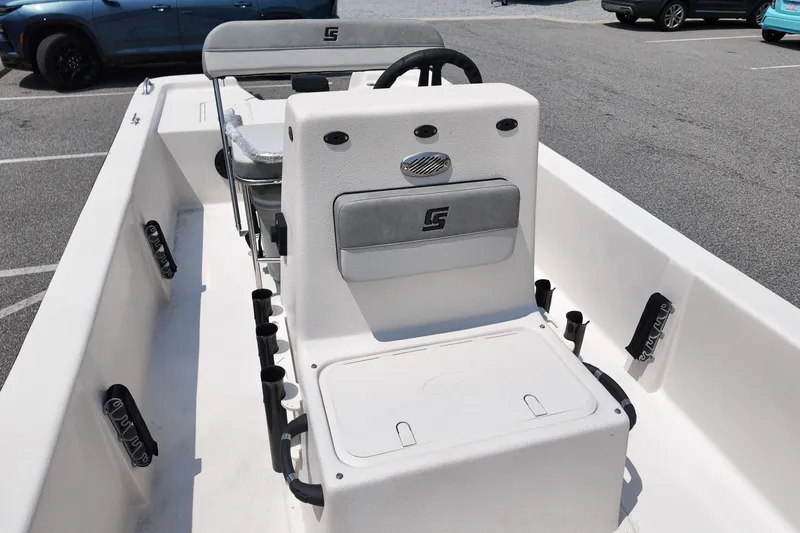 Slide: The Image of 2027 Carolina Skiff E18 JVX CC boat interior with steering console and seating. - 7