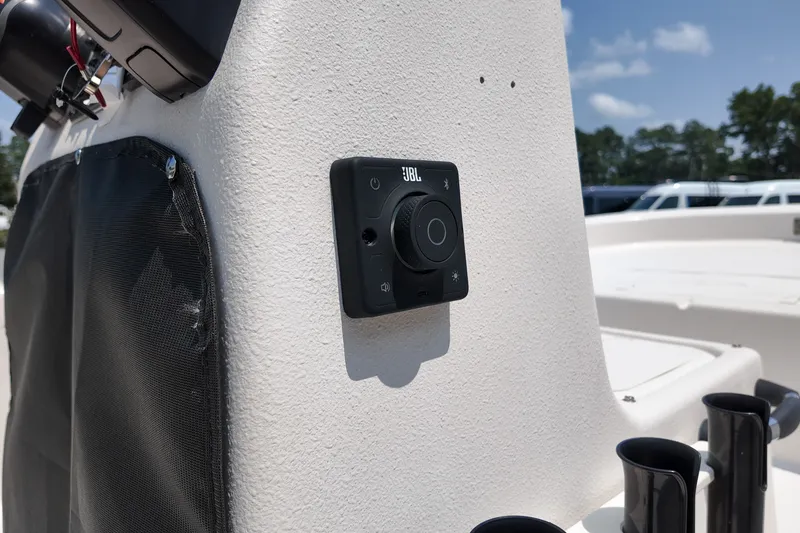 Slide: The Image of JBL audio control on 2027 Carolina Skiff E18 JVX CC boat console. - 11