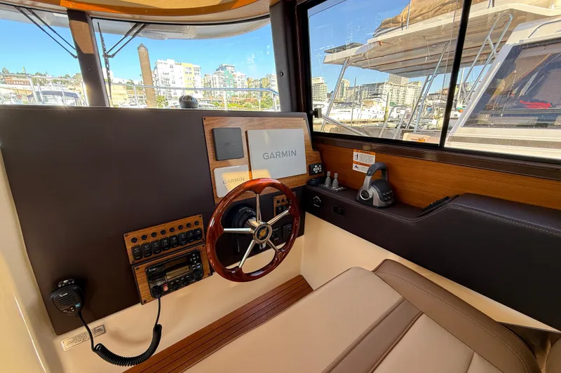 Slide: The Image of Interior helm of 2023 Ranger Tugs R-29 S with Garmin navigation system. - 6