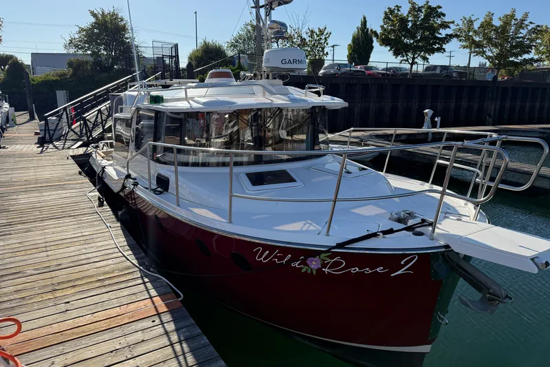 Slide: The Image of 2023 Ranger Tugs R-29 S docked, featuring sleek design and modern amenities. - 2