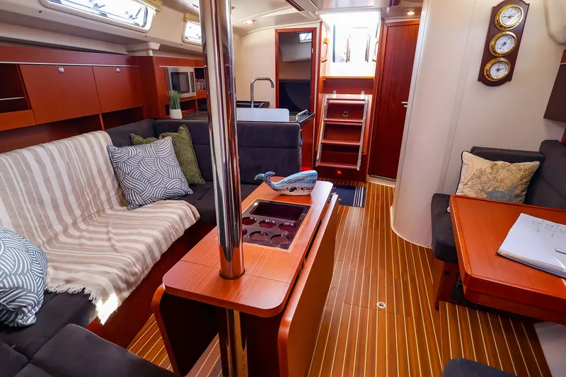 Slide: The Image of Luxurious interior of 2016 Hanse 385 yacht with elegant wood finish and cozy seating. - 41