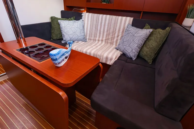 Slide: The Image of Interior of 2016 Hanse 385 yacht with cozy seating and decorative pillows. - 34