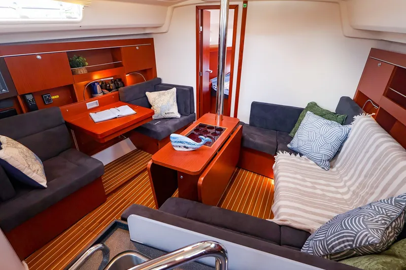 Slide: The Image of Interior of 2016 Hanse 385 yacht with cozy seating and elegant wood finish. - 22