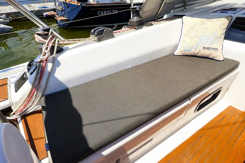 Slide: The Image of Cockpit seating on 2016 Hanse 385 sailboat with cushion and nautical pillow. - 54