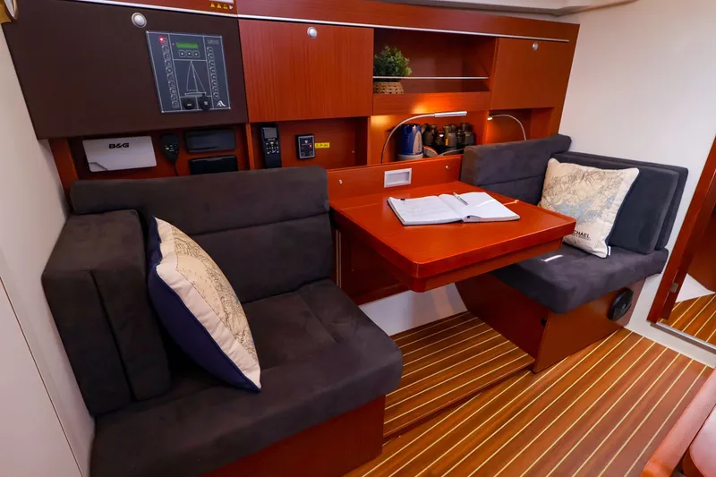 Slide: The Image of Interior of 2016 Hanse 385 yacht with cozy seating and navigation equipment. - 35