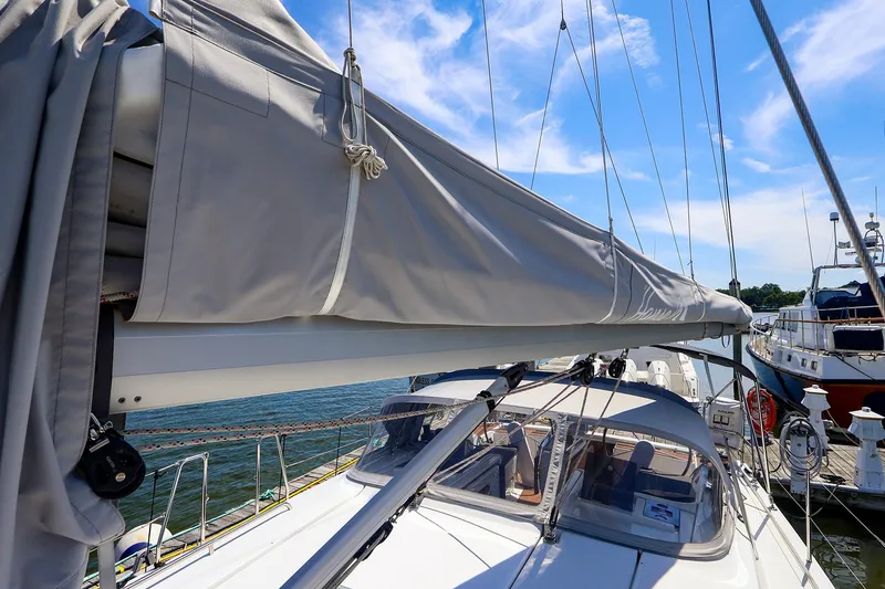 Slide: The Image of Sailboat Hanse 385 (2016) docked, featuring covered mainsail and clear blue sky. - 14