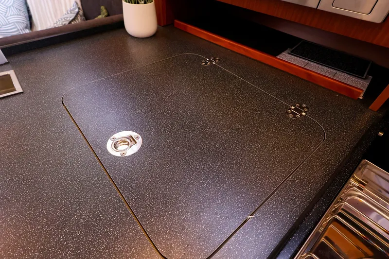 Slide: The Image of Interior of 2016 Hanse 385 yacht showing sleek countertop with integrated storage. - 29