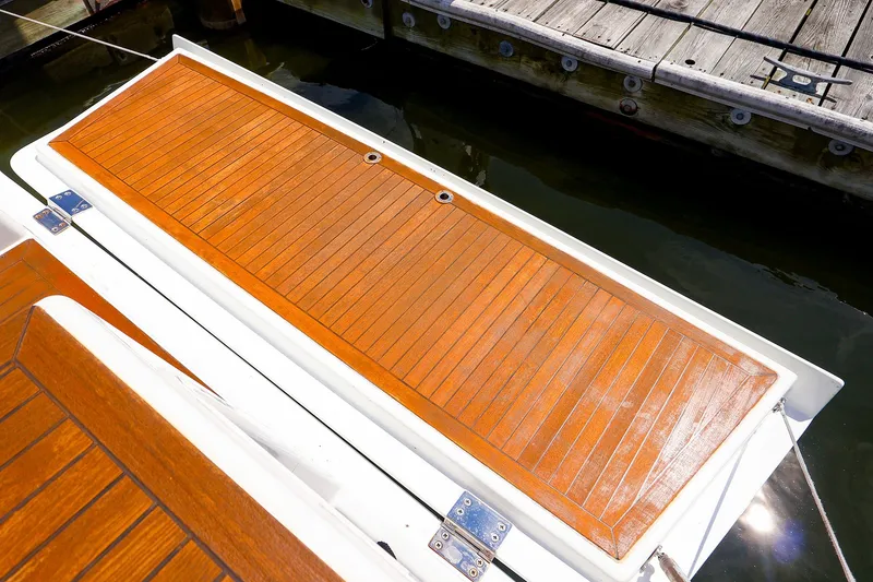 Slide: The Image of Teak deck of 2016 Hanse 385 yacht moored at a wooden dock. - 19