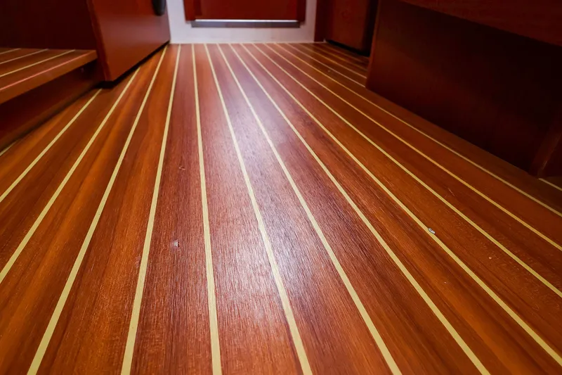 Slide: The Image of Polished wooden flooring inside a 2016 Hanse 385 yacht, showcasing elegant craftsmanship. - 44