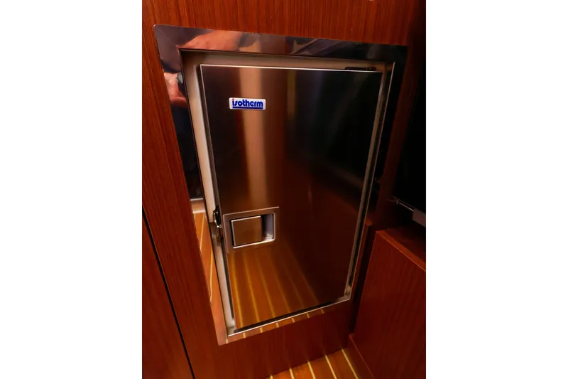 Slide: The Image of Stainless steel Isotherm fridge on 2016 Hanse 385 yacht, wooden interior. - 27